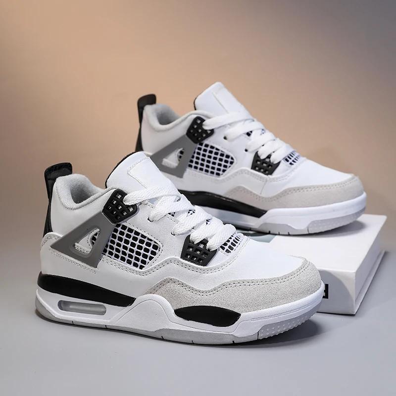 Une paire de chaussures d'entraînement sportives à tige en cuir pour enfants, chaussures décontracté