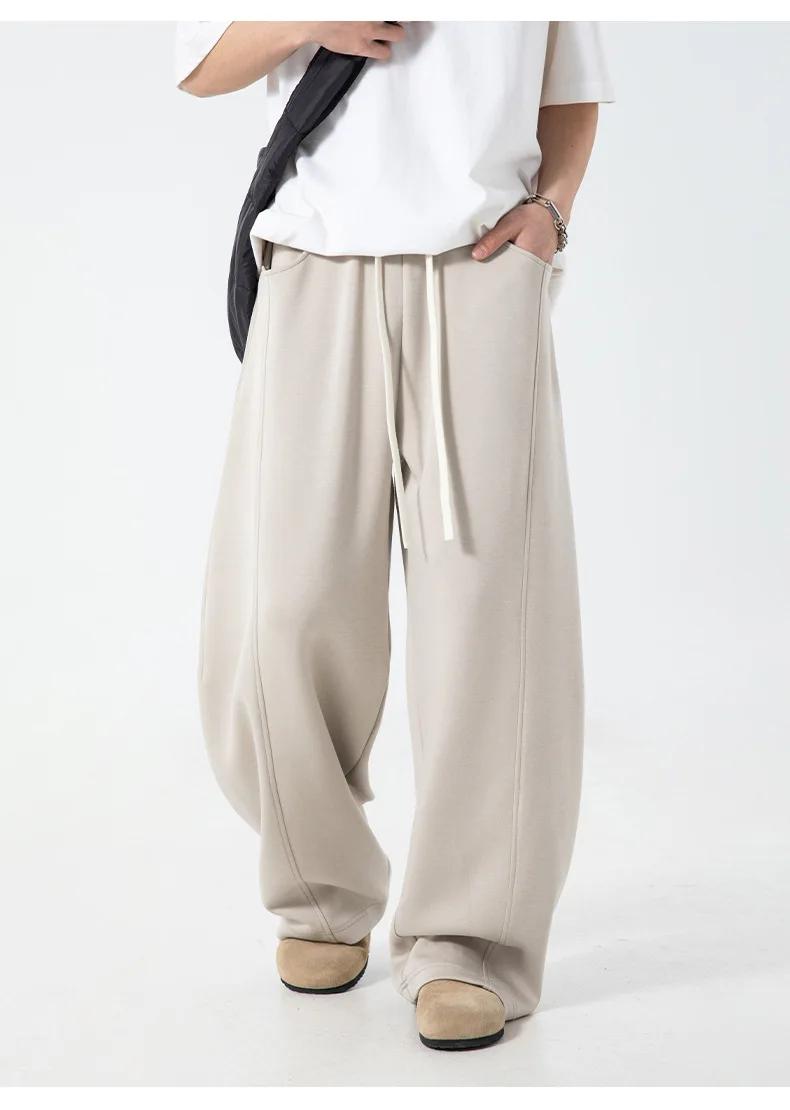 Pantalon décontracté texturé à coutures fendues pour hommes, surdimensionné, jambes incurvées, drapé