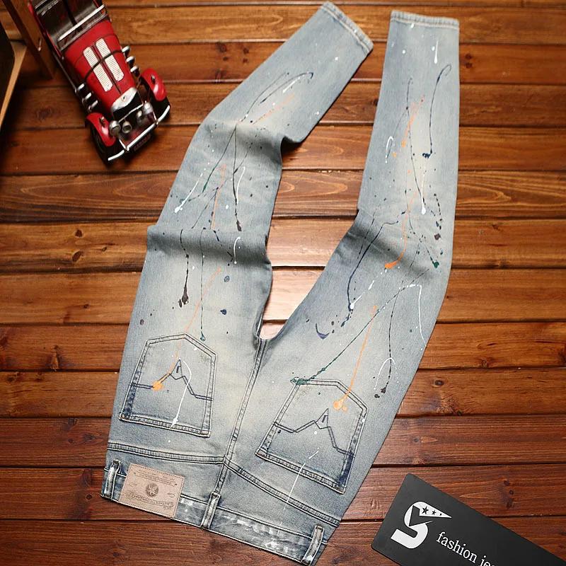Jean déchiré pour hommes, coupe slim avec petits pieds, imprimé d'encre éclaboussée, pantalon à la m