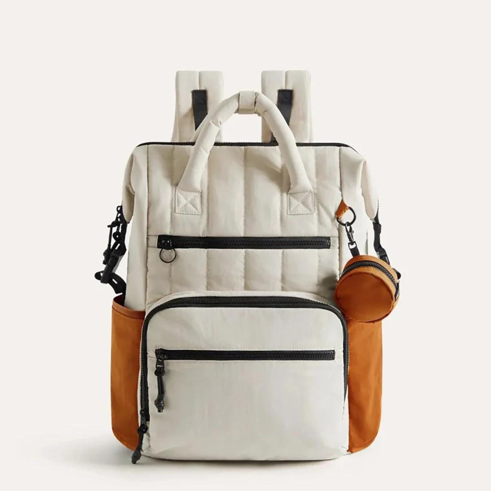 Sac à couches à dos contrasté blanc et vert, avec petite pochette, organisateur minimaliste des esse