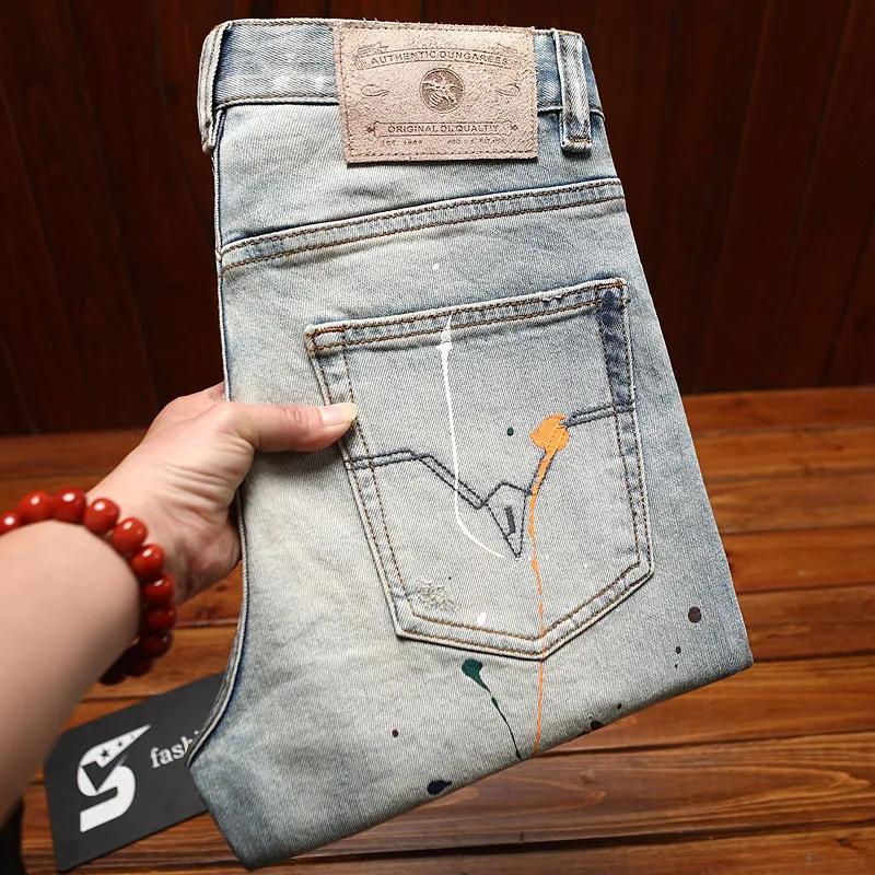 Jean déchiré pour hommes, coupe slim avec petits pieds, imprimé d'encre éclaboussée, pantalon à la m