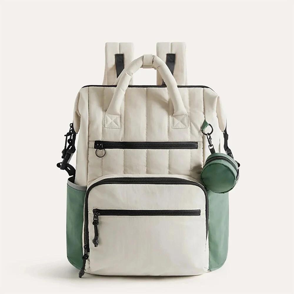 Sac à couches à dos contrasté blanc et vert, avec petite pochette, organisateur minimaliste des esse