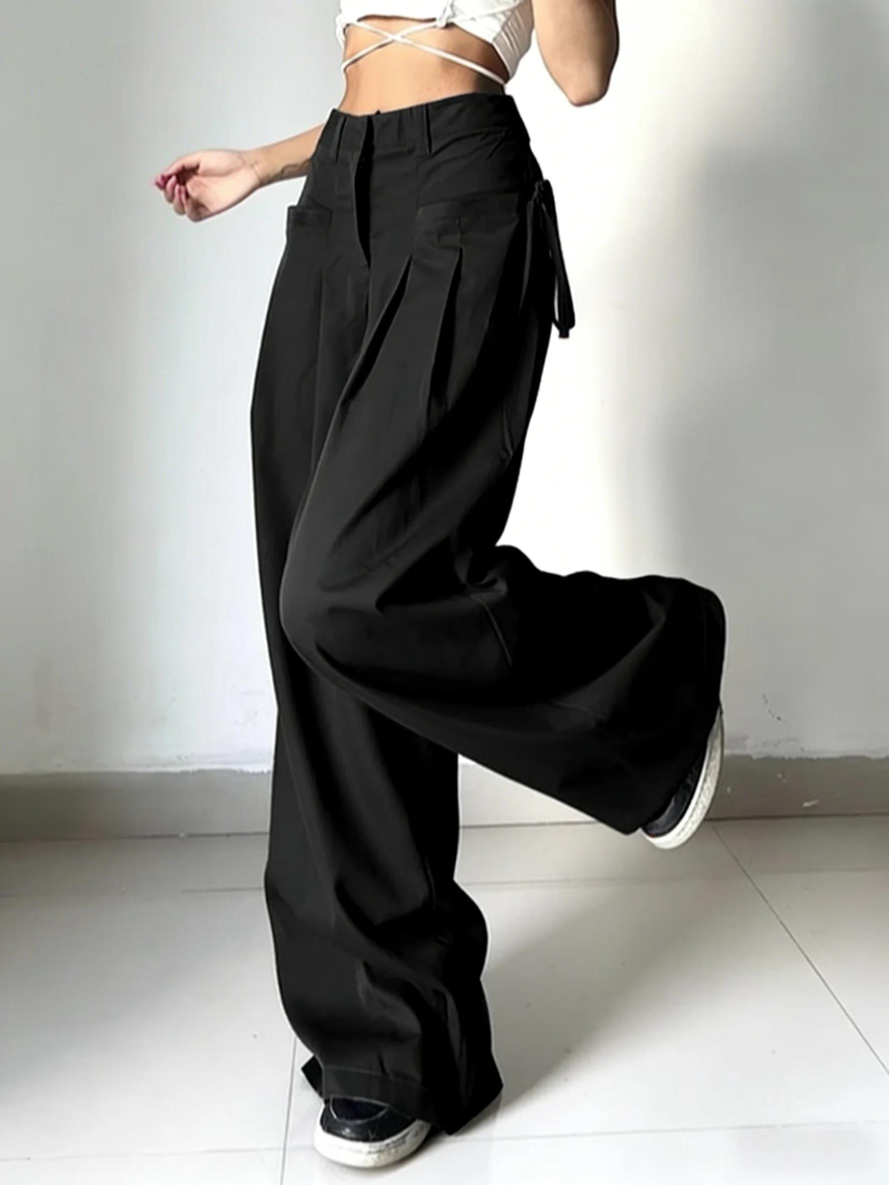 Pantalon de costume noir taille haute pour femme, coupe large, plissé devant, avec détail de nouage 