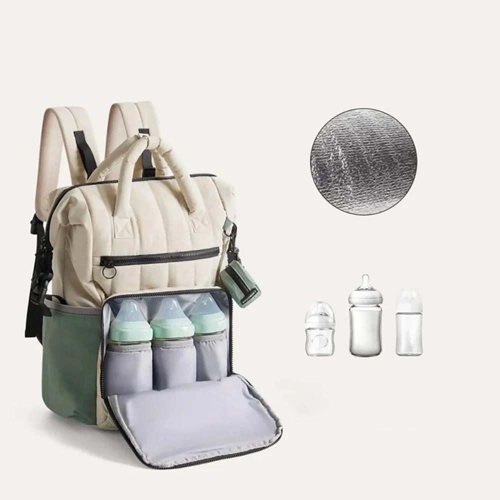 Sac à couches à dos contrasté blanc et vert, avec petite pochette, organisateur minimaliste des esse