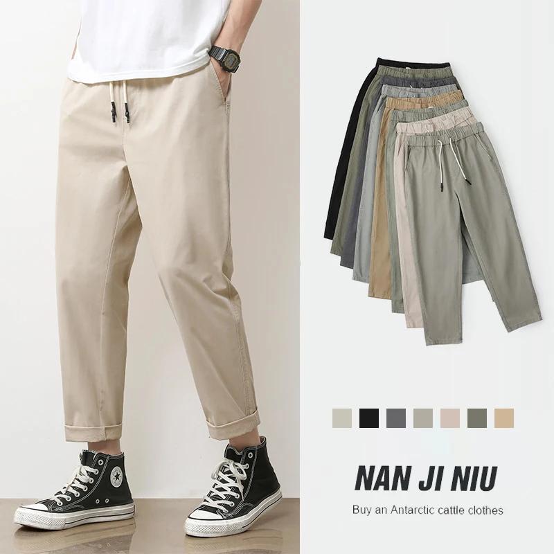 Pantalon décontracté pour homme en coton respirant, couleur unie gris kaki, idéal pour le printemps 