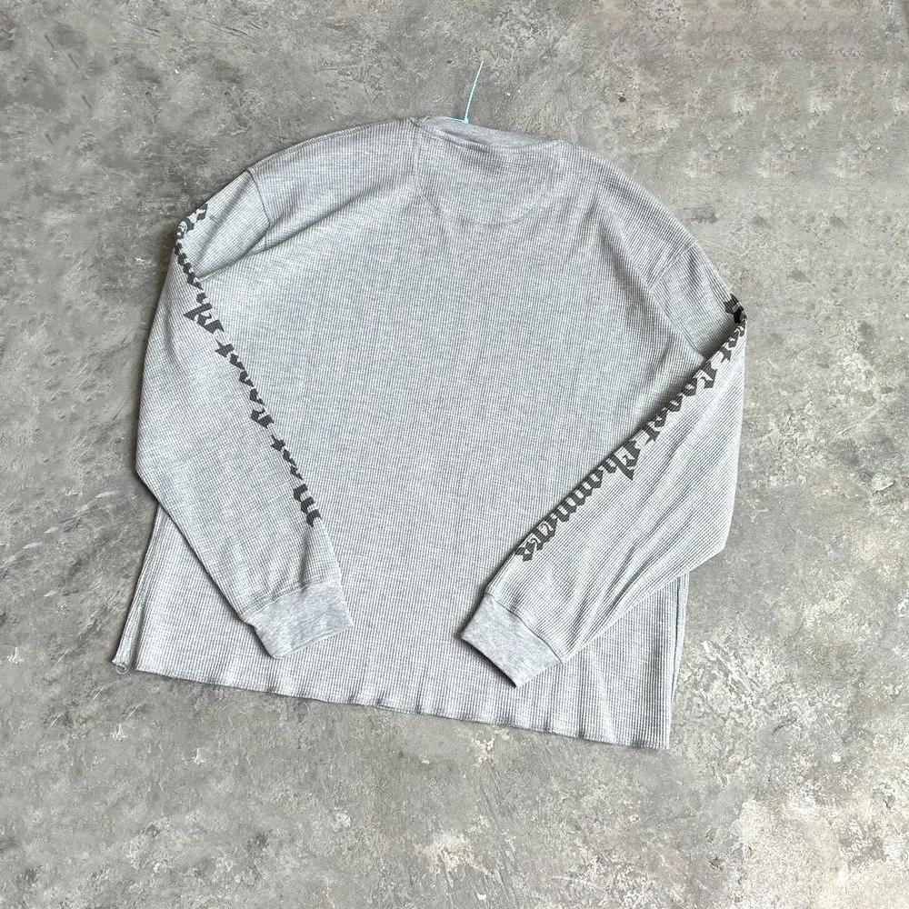Yao mode Vintage ample Streetwear HipHop sanskrit Logo imprimé t-shirt de haute qualité à manches lo