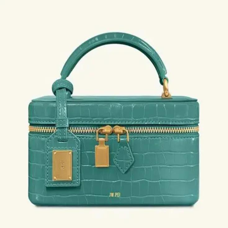 Sac bandoulière de luxe pour femme en cuir texturé avec logo lettre, également un élégant sac à lang
