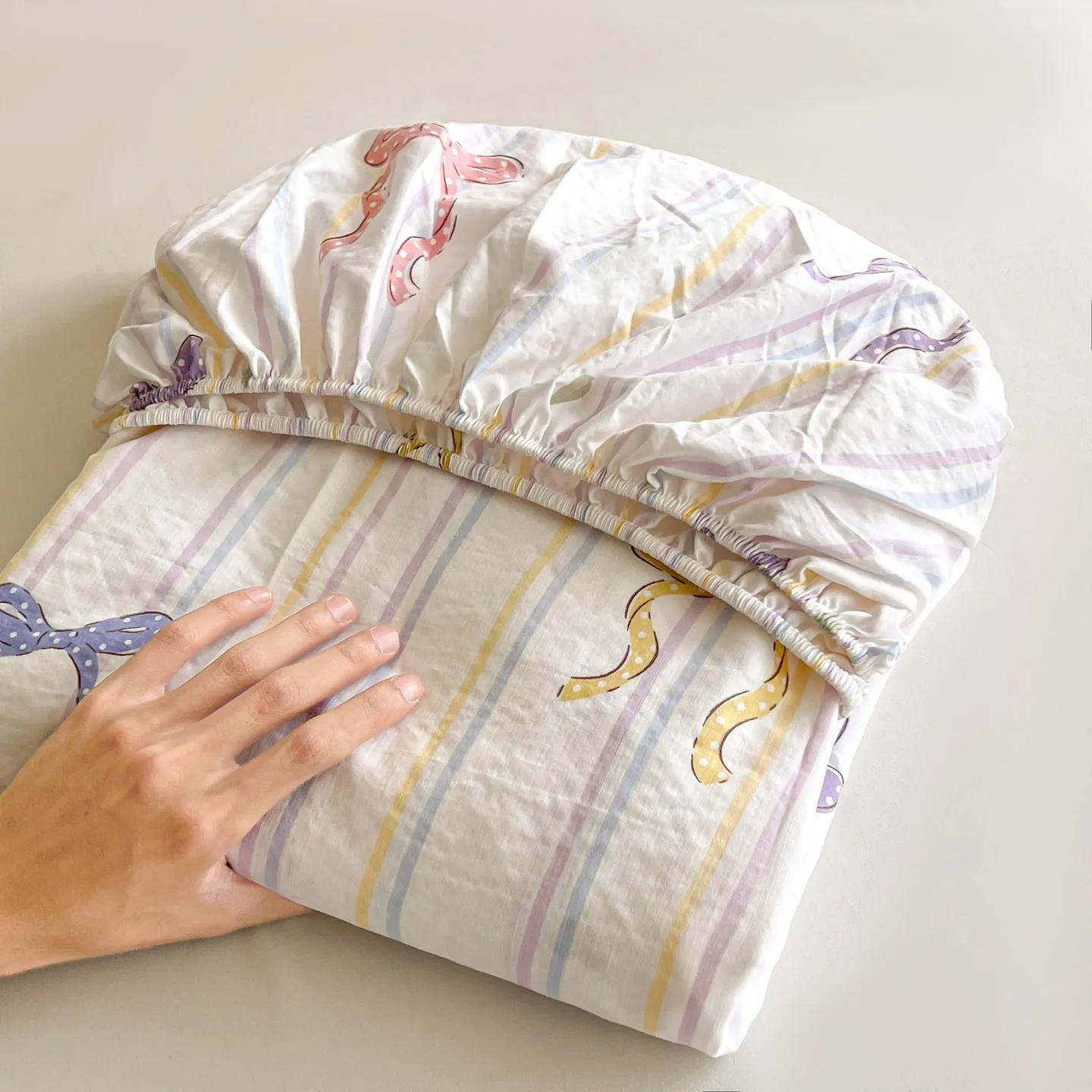 Ensemble de draps de lit à nœud rayé