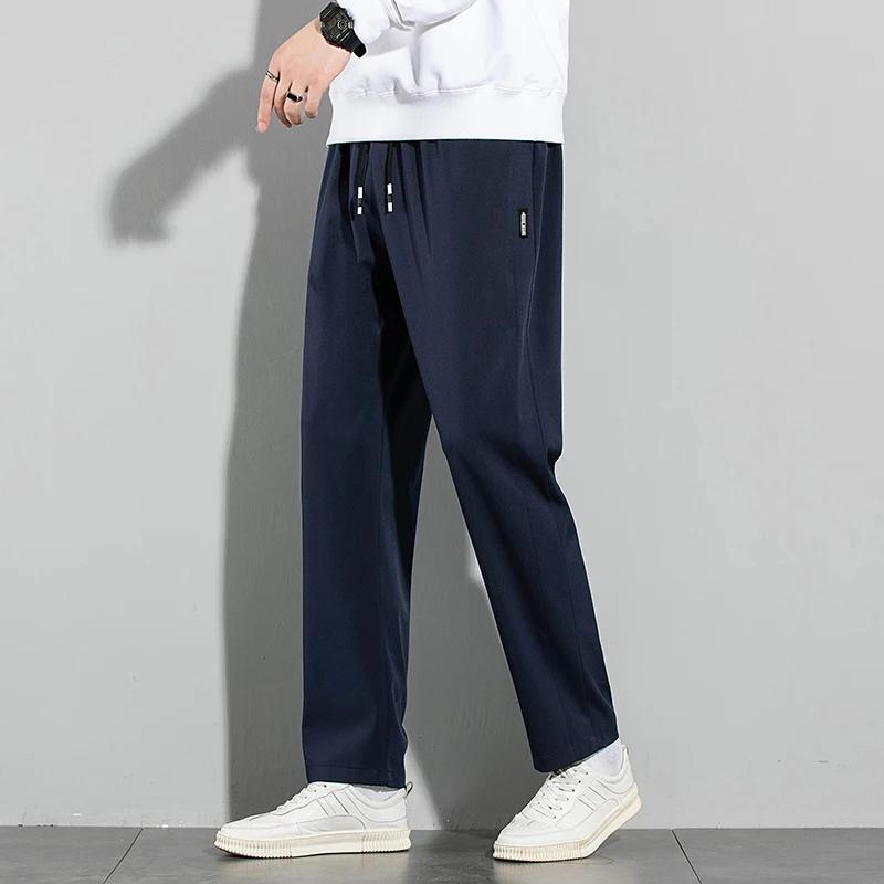 Pantalons pour hommes en soie glacée 2025 été nouveau noir gris mince pantalons décontractés d'affai