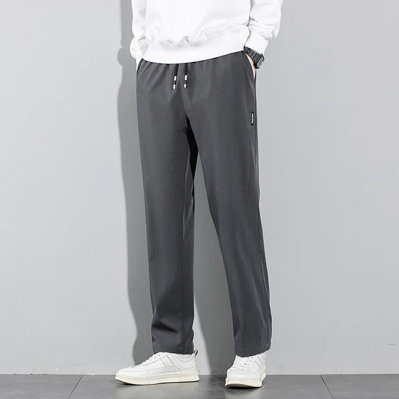 Pantalons pour hommes en soie glacée 2025 été nouveau noir gris mince pantalons décontractés d'affai