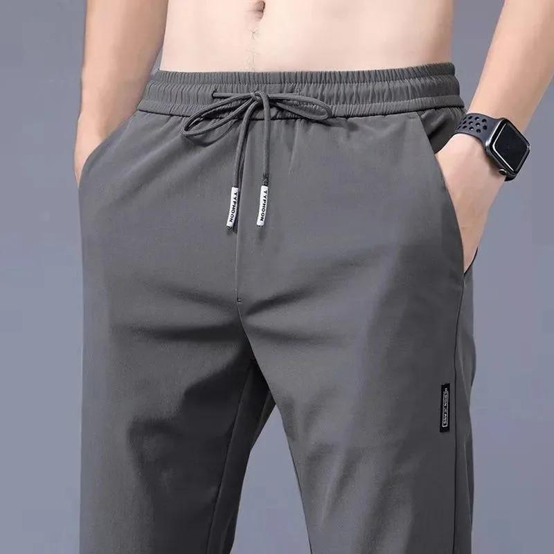 Pantalons pour hommes en soie glacée 2025 été nouveau noir gris mince pantalons décontractés d'affai