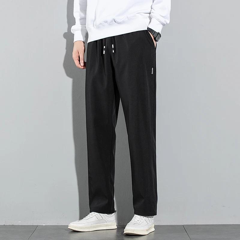 Pantalons pour hommes en soie glacée 2025 été nouveau noir gris mince pantalons décontractés d'affai