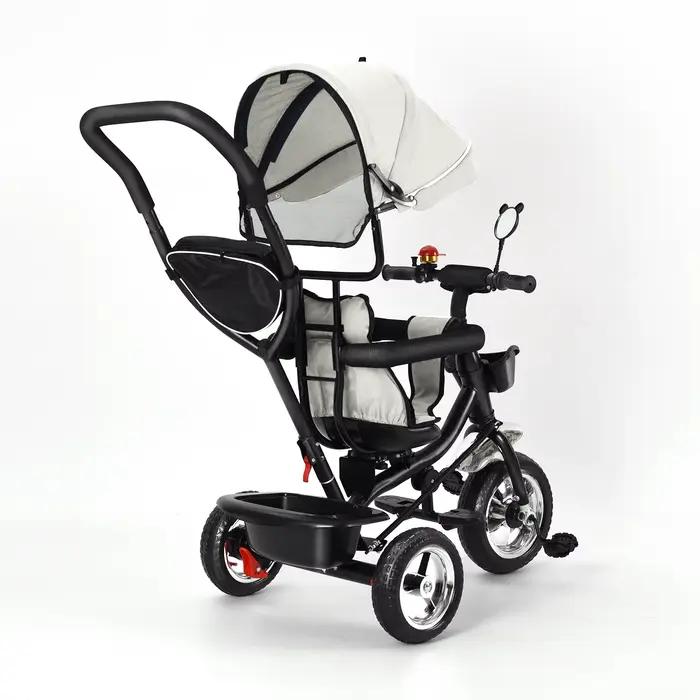 Tricycle avec barre de poussée, siège rotatif, voyage avant et arrière, auvent pliable avec protecti