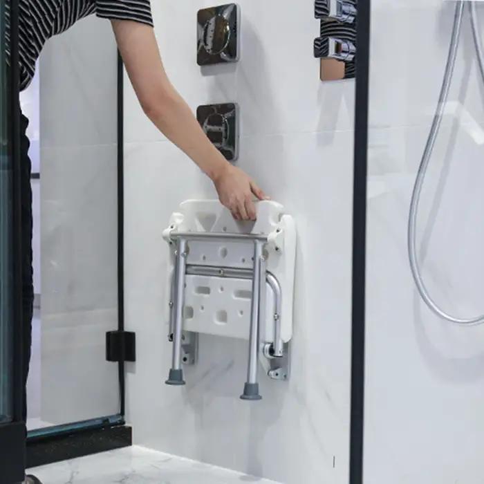Banc de douche pliant avec pieds antidérapants et fente de pomme de douche pour une utilisation sûre et élégante dans la salle de bains occasions spéciales