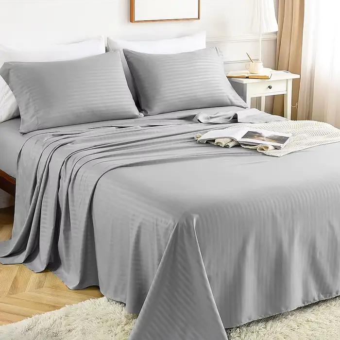 Ensemble de draps de lit de luxe Battilo avec motifs de rayures solides pour jumeaux Queen King Size four pieces drap plat taies d'oreiller confort literie haut de gamme