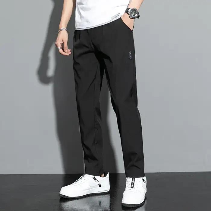 Pantalons pour hommes en soie glacée 2025 été nouveau noir gris mince pantalons décontractés d'affai