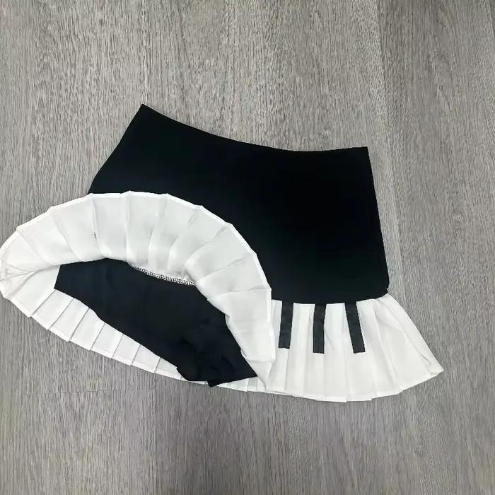 Printemps noir blanc épissé femmes jupe courte Y2k conception mince Harajuku Mini jupe femme Empire